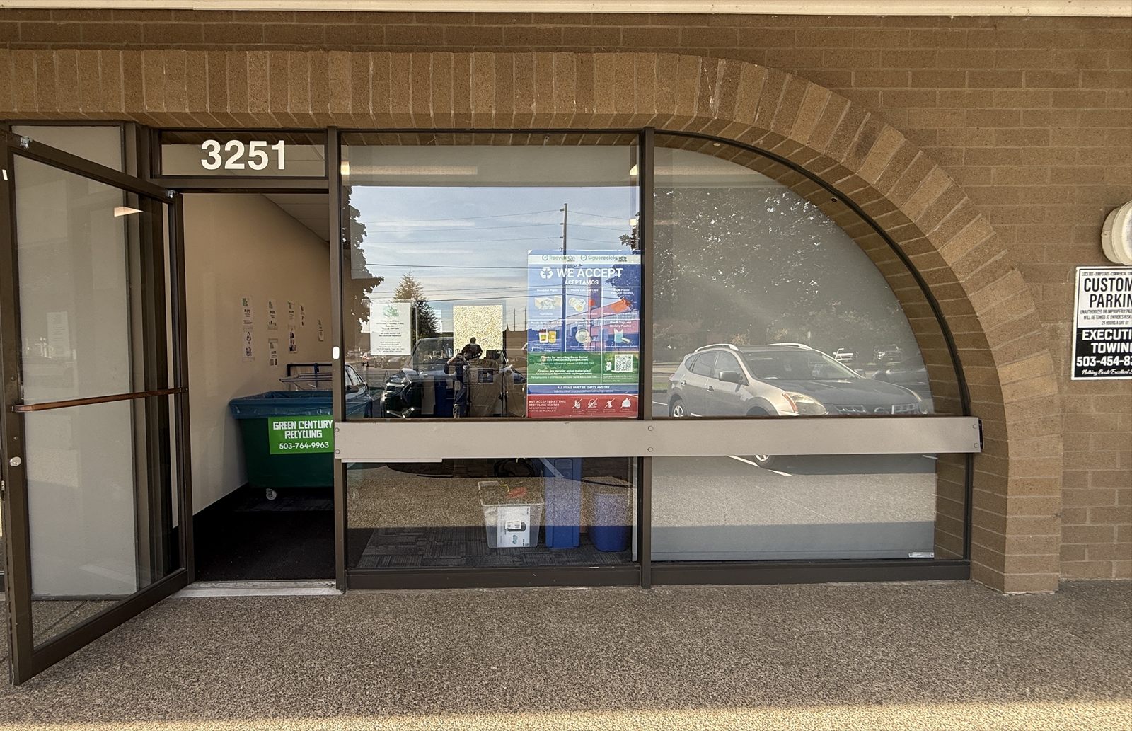 Entrance to the NW Portland recycling drop-off at 3251 NW 29th Ave, with the door open and a recycling bin inside.